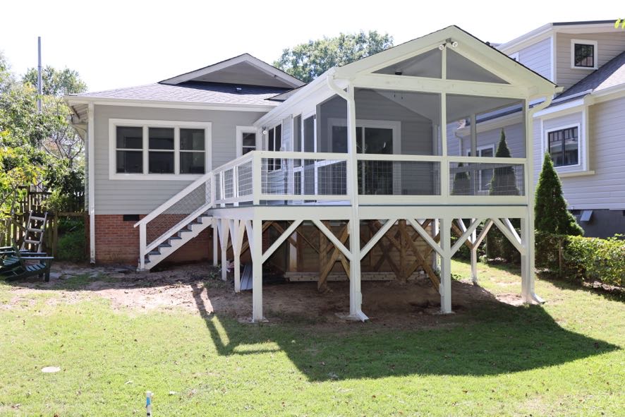 Custom screened porch addition with cable railing and vaulted ceiling in Durham NC