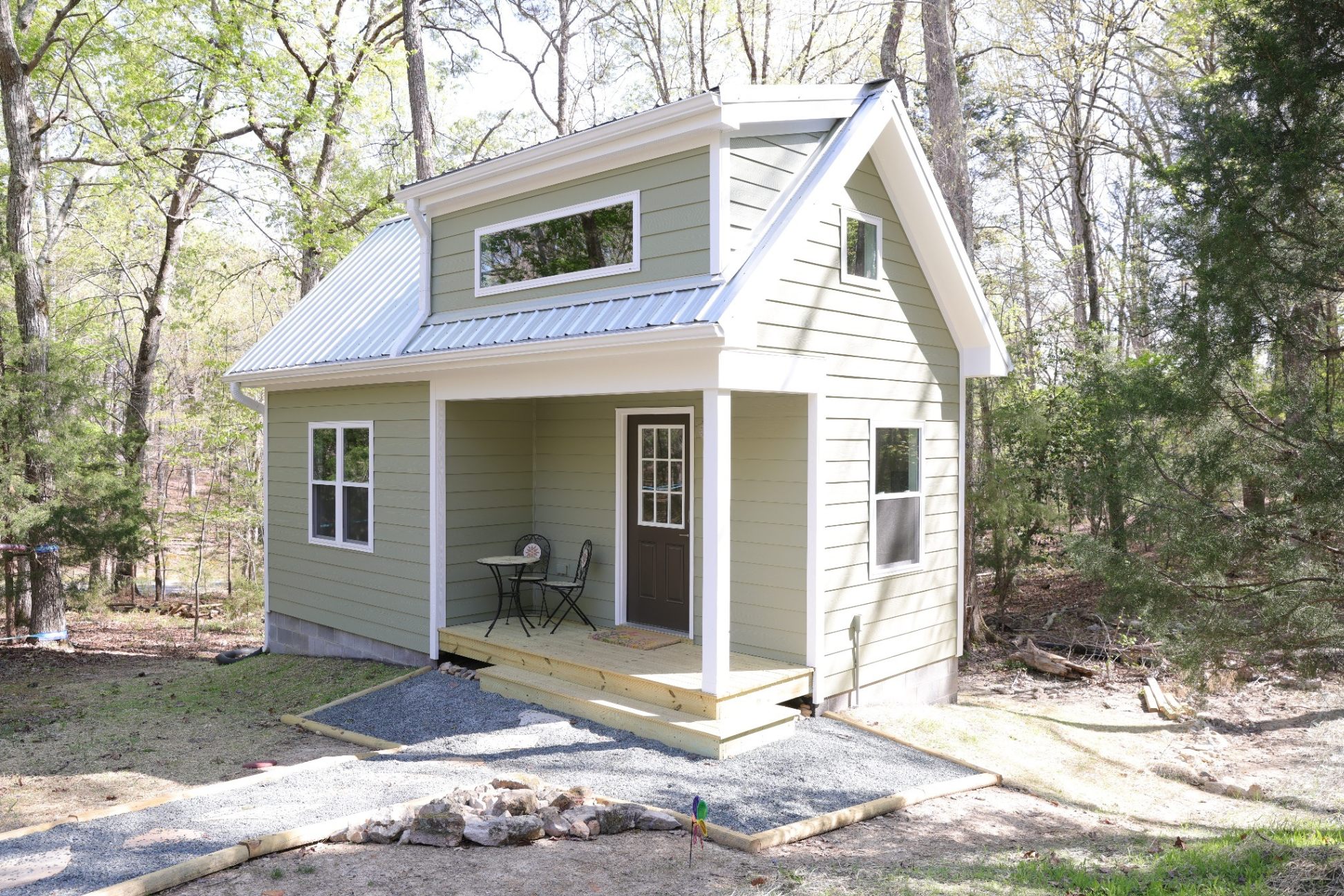 Finished custom backyard office shed with covered porch and metal roof in Durham NC by Morgan Remodeling