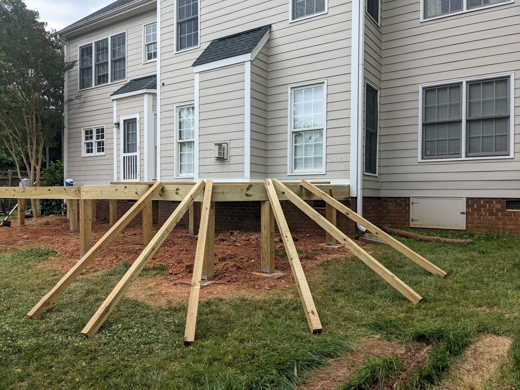 Deck framing with diagonal bracing and stair stringers in Raleigh NC