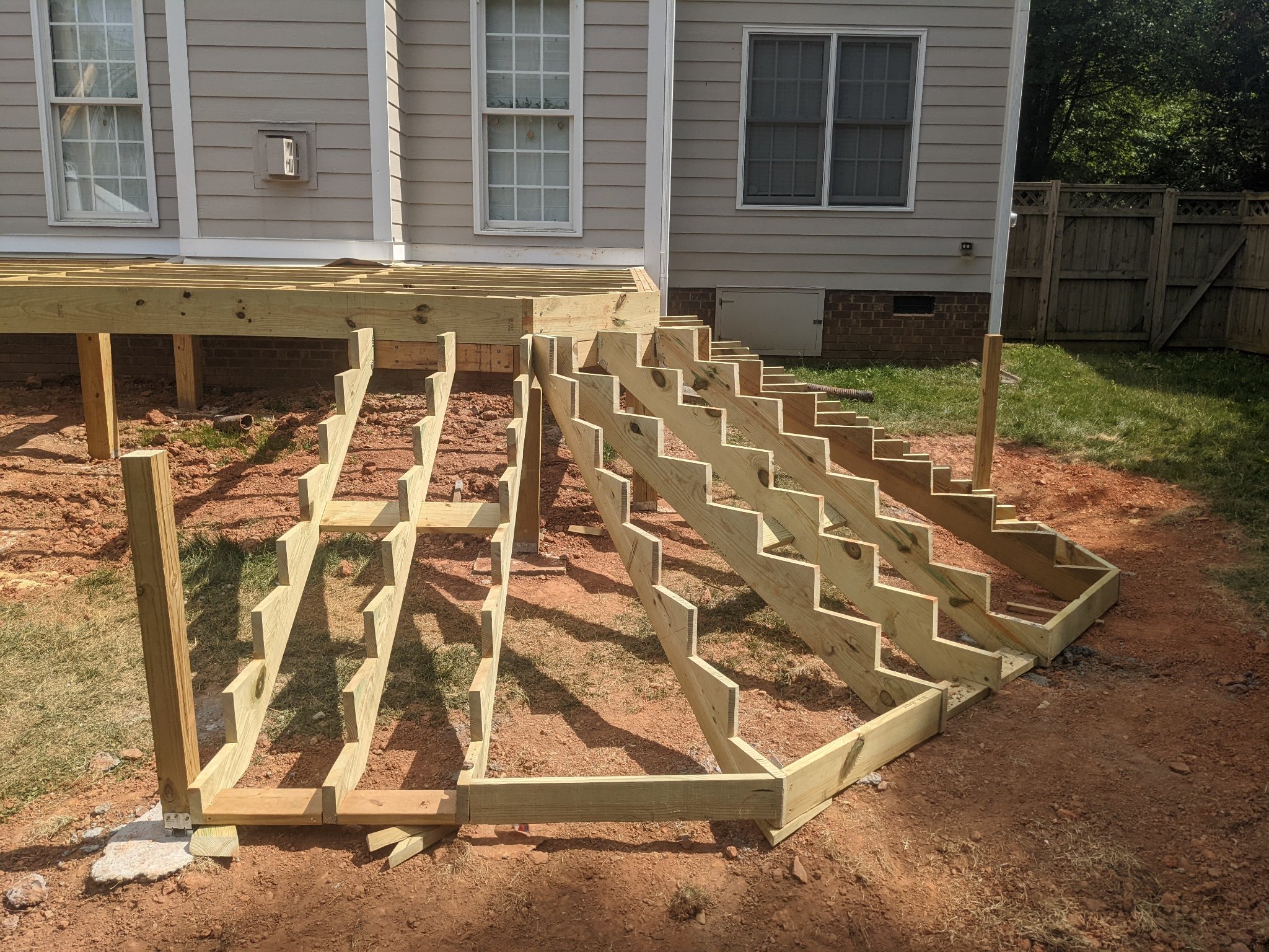 Deck joist framing with joist tape and pergola posts in Raleigh NC