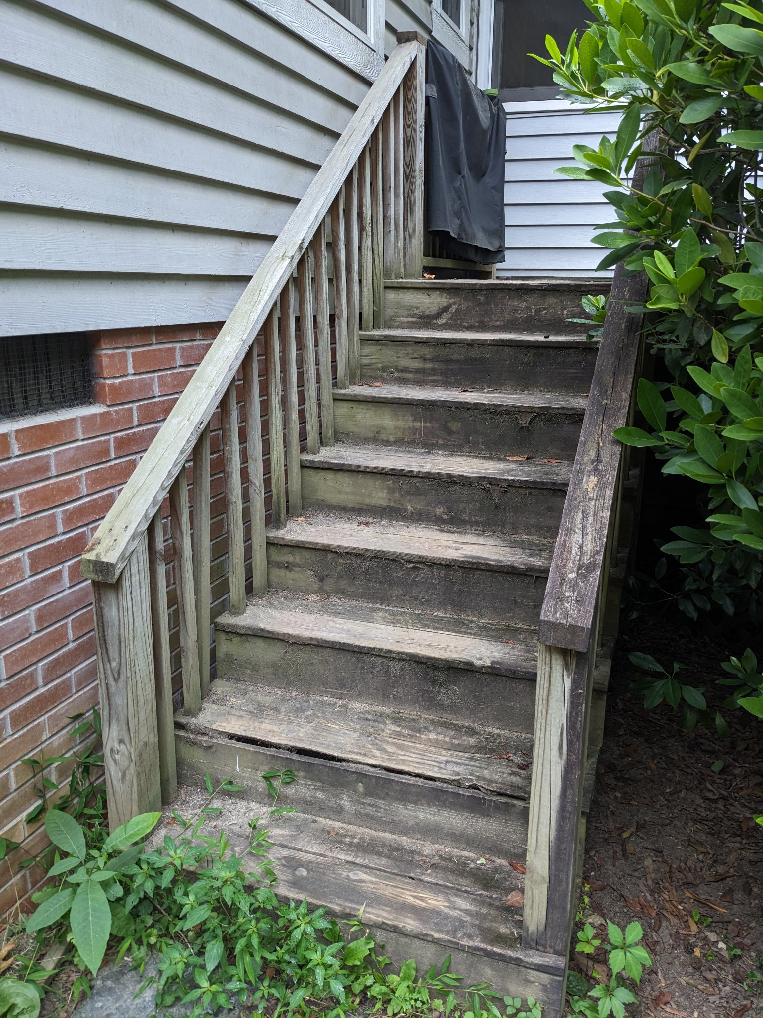 Original weathered stair with rotted treads before replacement in Durham NC