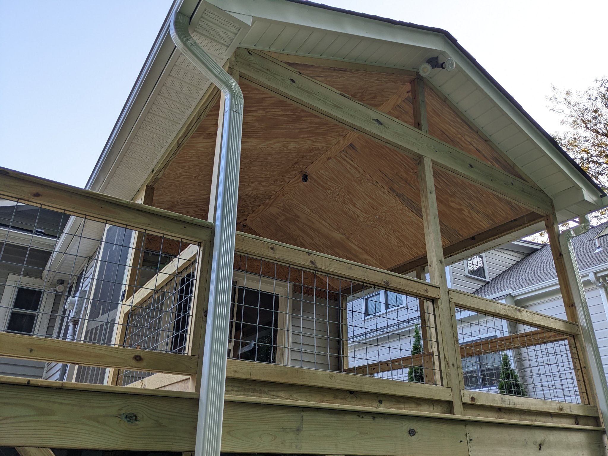 Screened porch gable framing and roof sheathing during construction in Durham NC