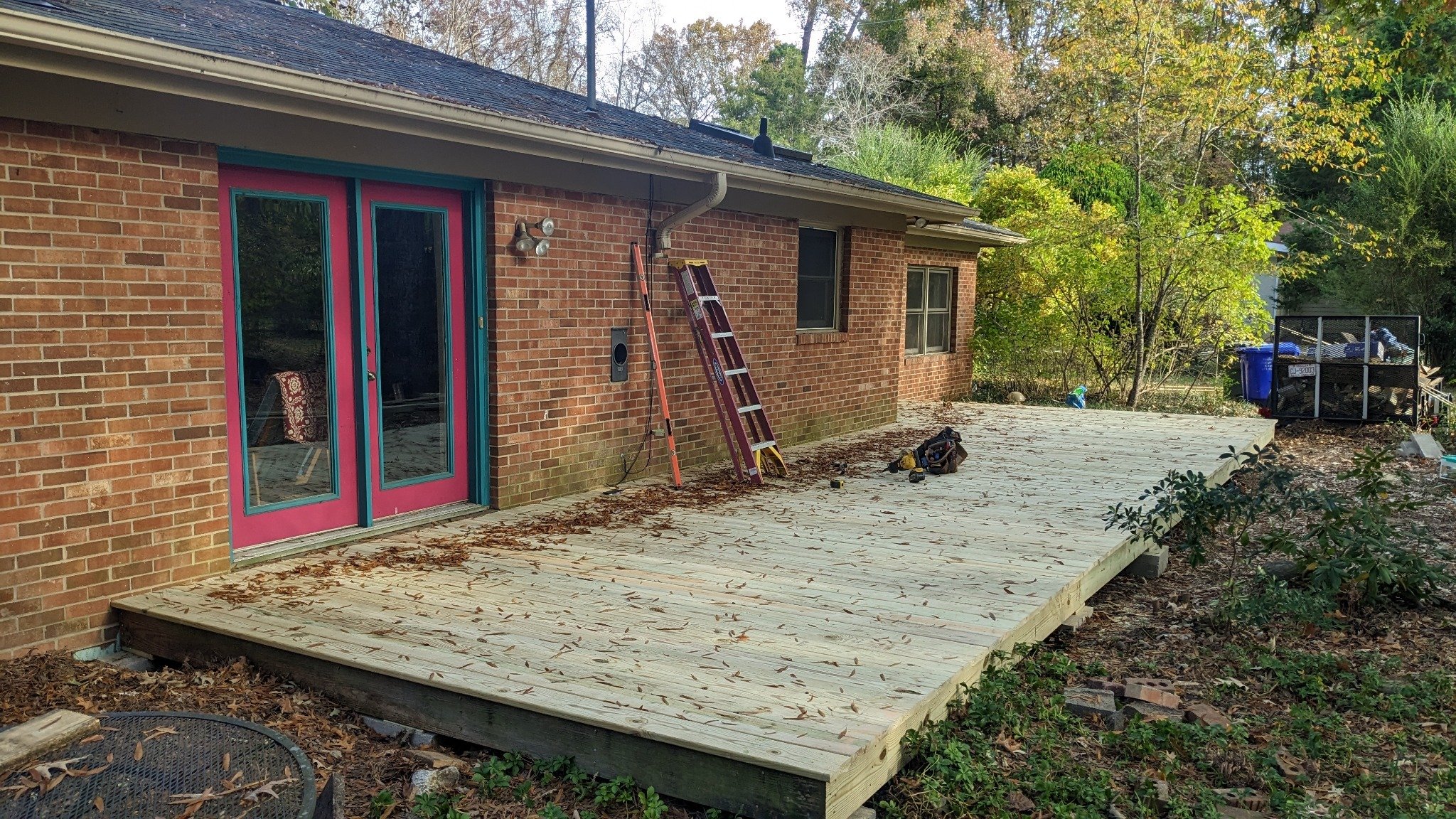 New deck platform boards installed with framing complete during screened porch construction in Carrboro NC