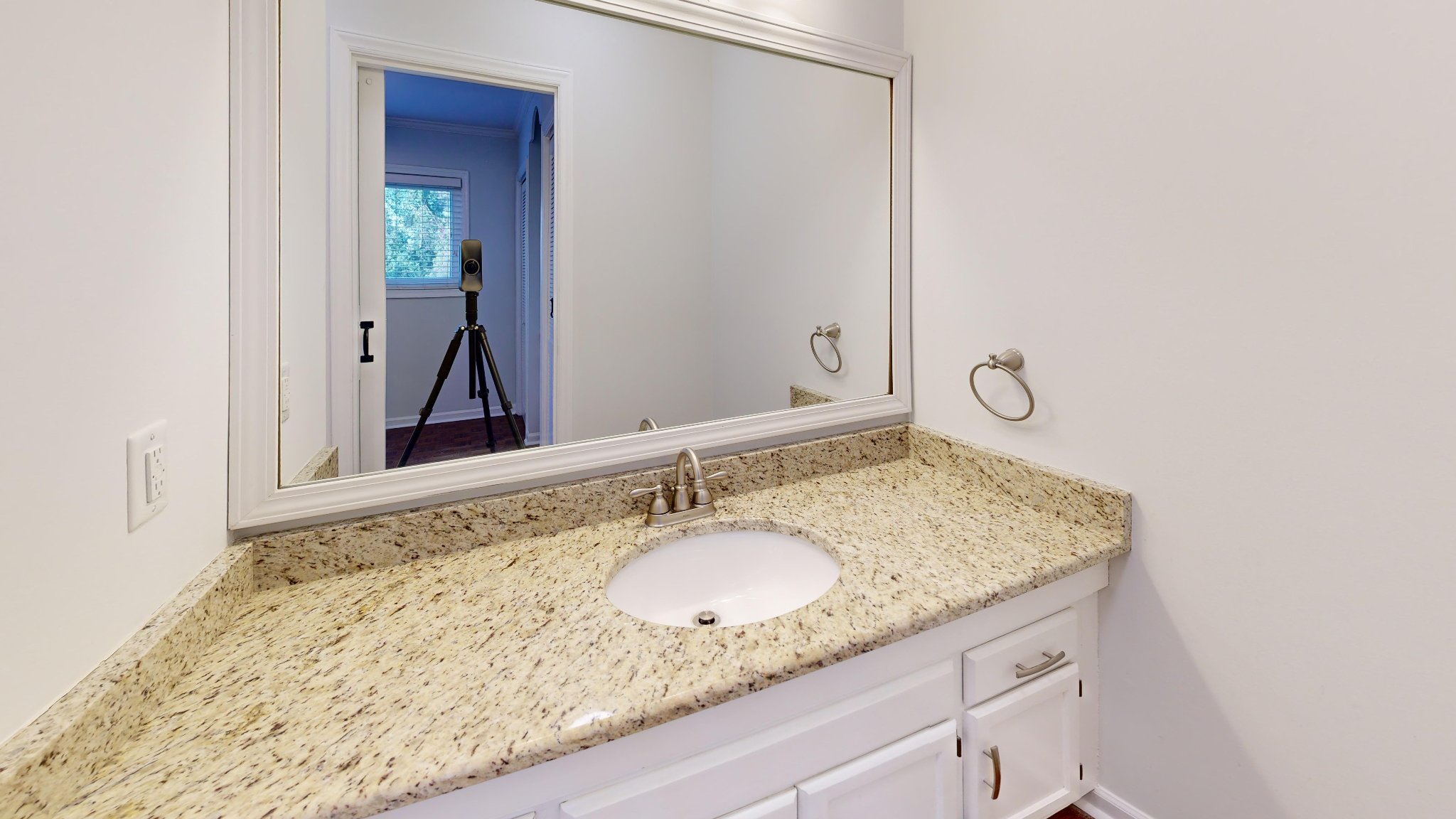 Renovated bathroom with granite vanity in Raleigh townhouse