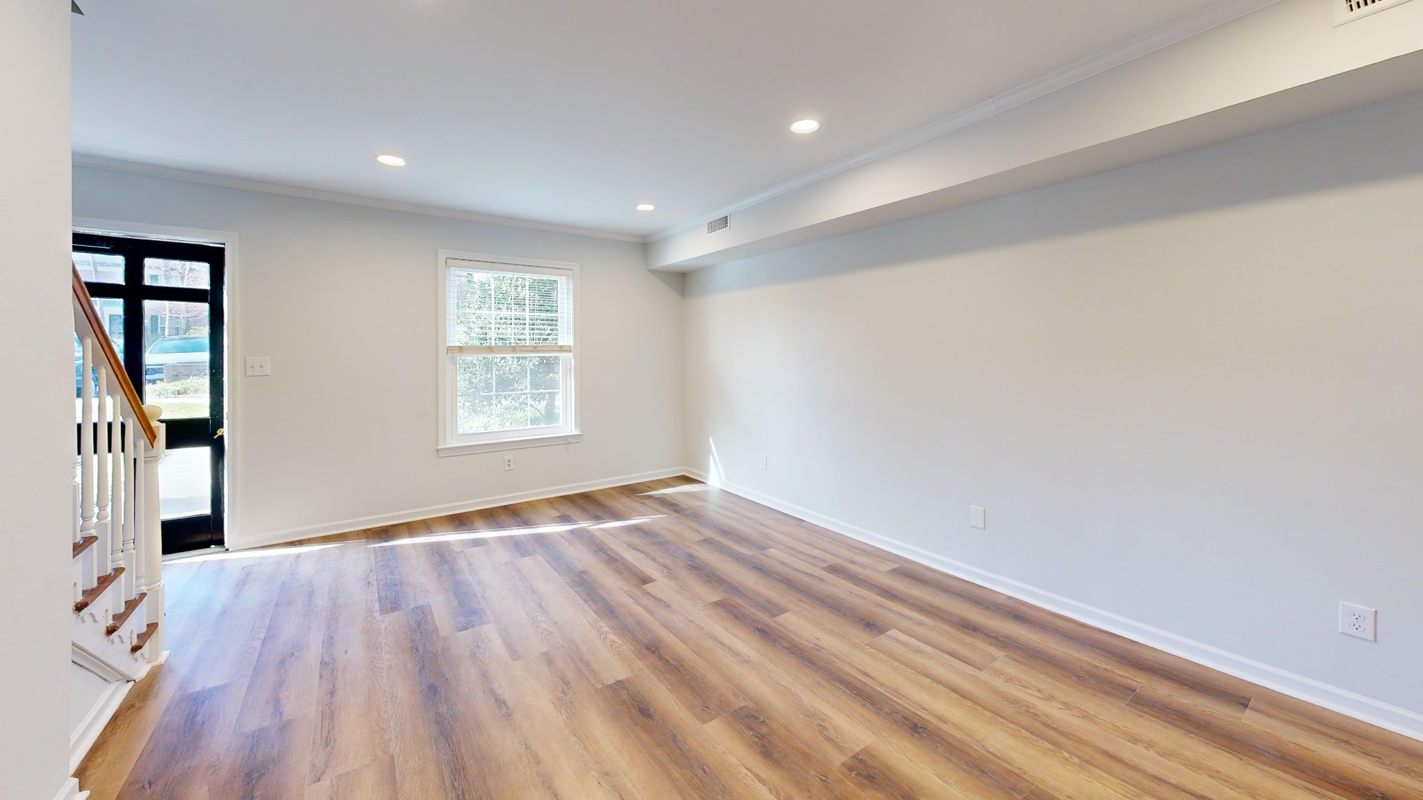 Townhouse interior renovation with hardwood floors and fresh paint in Raleigh NC